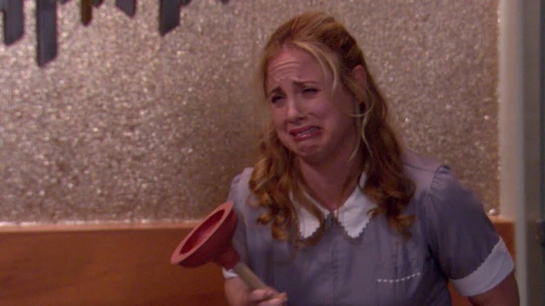 Coco cries with plunger