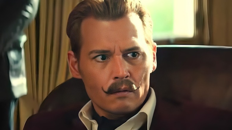 Mortdecai wearing a scarf