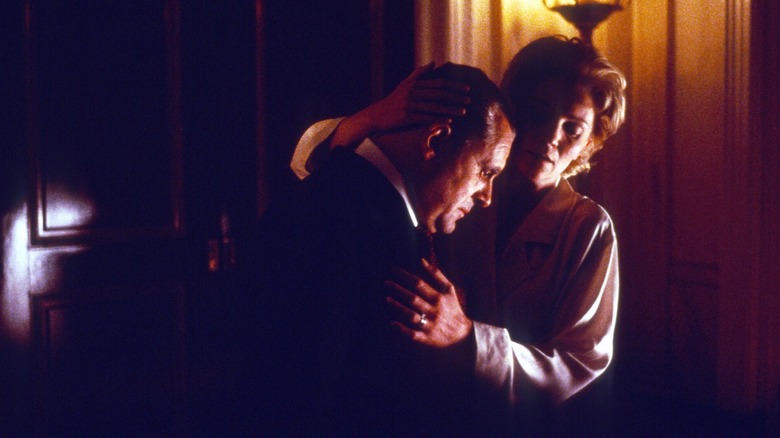 Richard and Pat Nixon embracing in Nixon (1995)