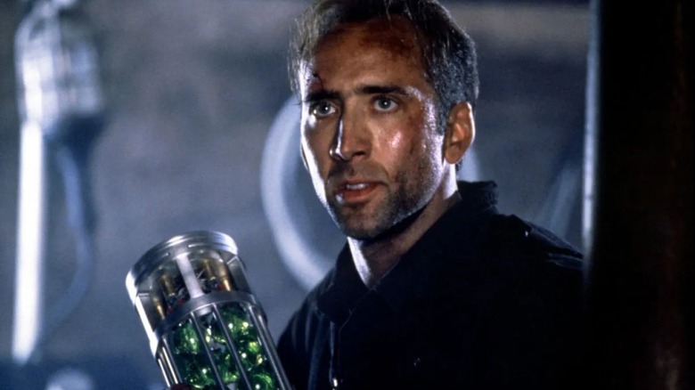 Dr. Stanely Goodspeed holds a canister of toxins in "The Rock" (1996)