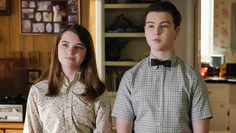 Sheldon and Missy standing side-by-side