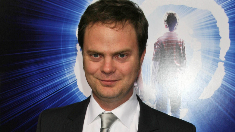 Rainn Wilson in a black suit smiling at "The Last Mimzy" premiere in 2007
