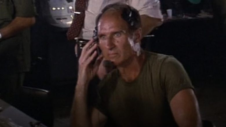 The radio operator listens in in "Rambo: First Blood Part II"