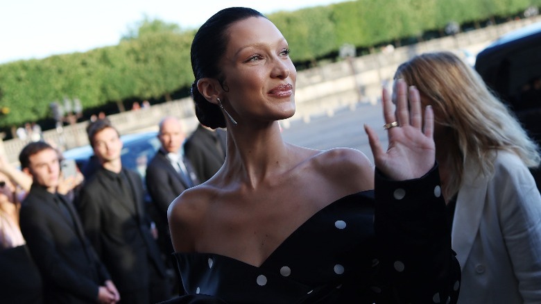Bella Hadid waving her hand