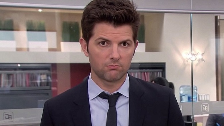 Adam Scott looks at camera