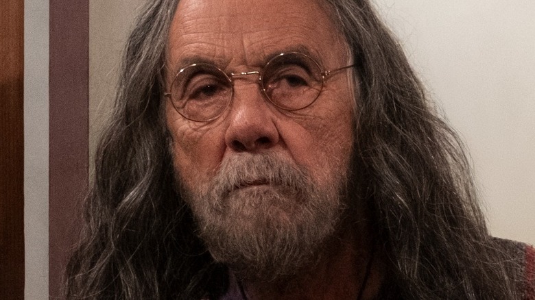 Tommy Chong looks out door