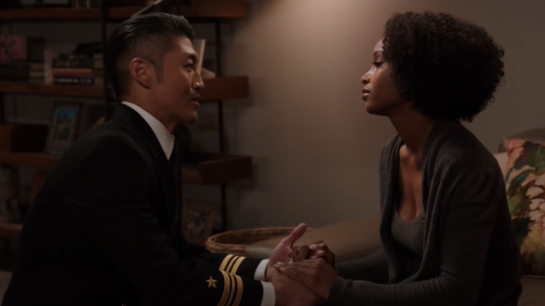 Ethan holding April's hands