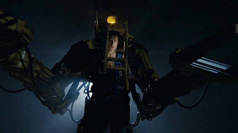 Ripley looks determined in a robotic power loader