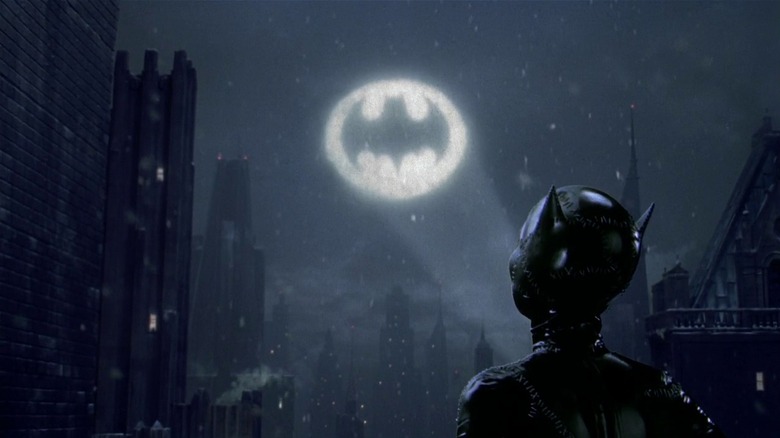 Catwoman looks at Batsignal