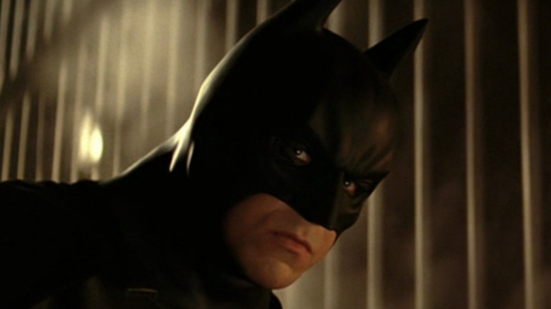 Batman leans forward