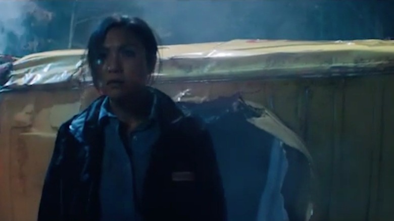 Host emerging from ambulance
