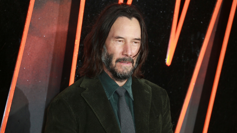 Keanu Reeves posing at 