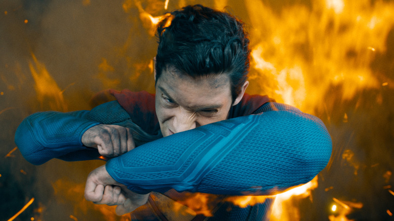 Superman flies through flames in "Superman" (2025)