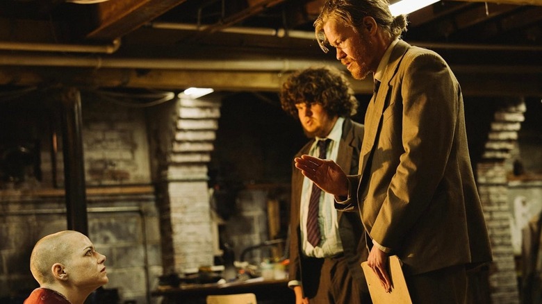 Michelle Fuller staring up at her captors in Bugonia (2025)