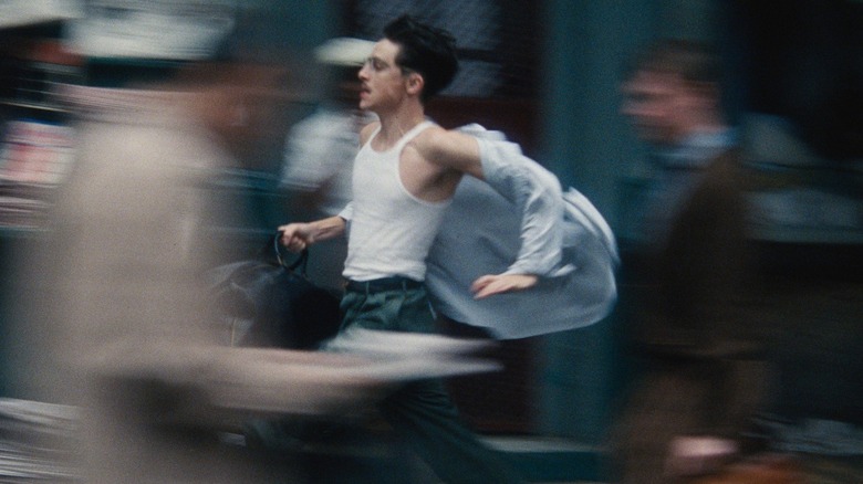 Marty Mauser running through the New York streets in Marty Supreme (2025)