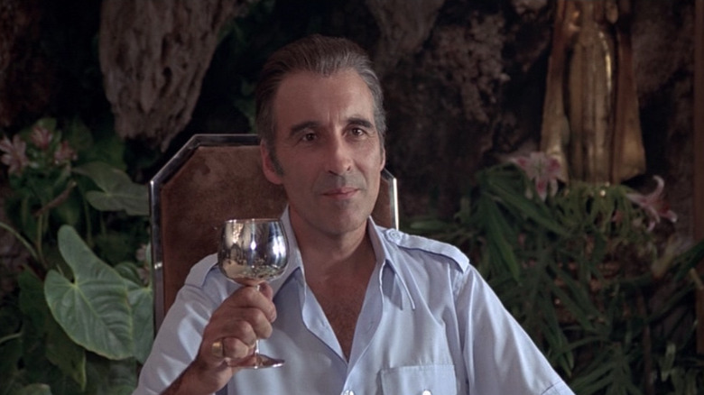 Scaramanga toasts to his duel with Bond