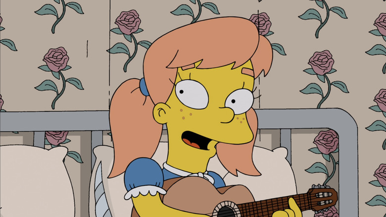 Mary Spuckler playing guitar