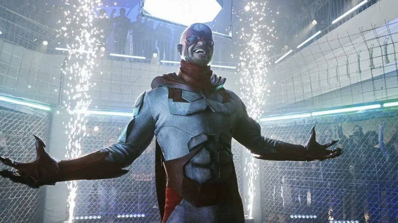 Hawk laughs while in a fighting cage on "Titans" (2018-2022)