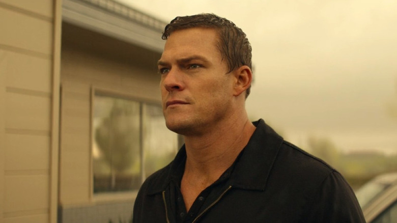 Reacher outside a house