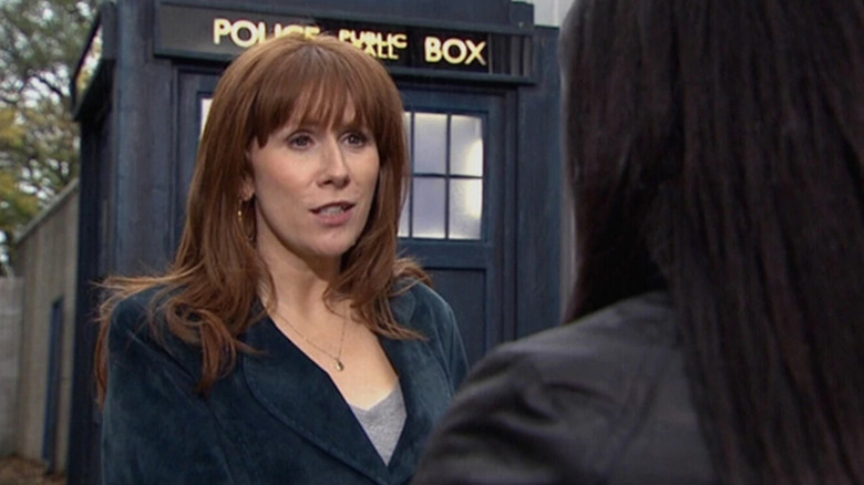 Donna in front of the TARDIS