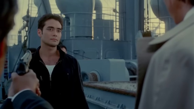Toby Wong surrounded by armed assailants