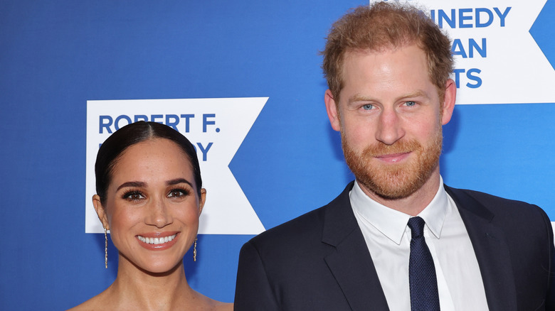 Prince Harry and Meghan Markle smile