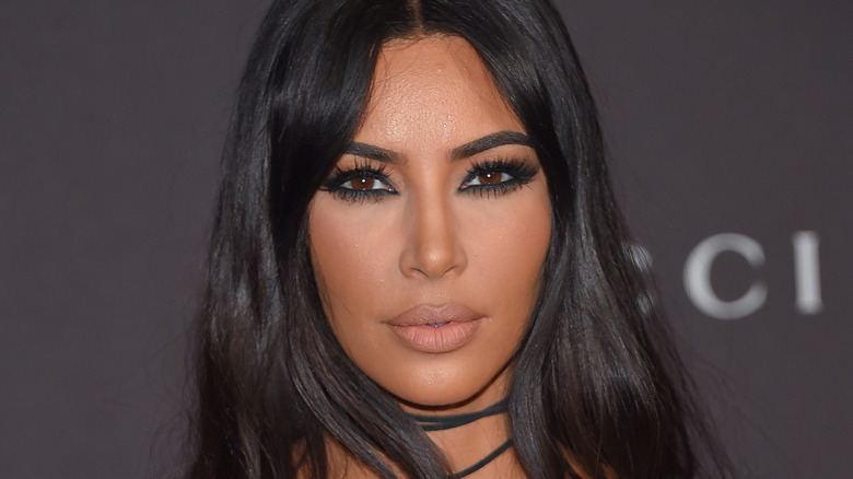 Kim Kardashian poses on the red carpet