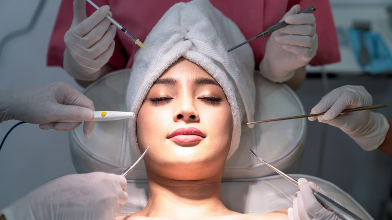 Women surrounded by surgical tools