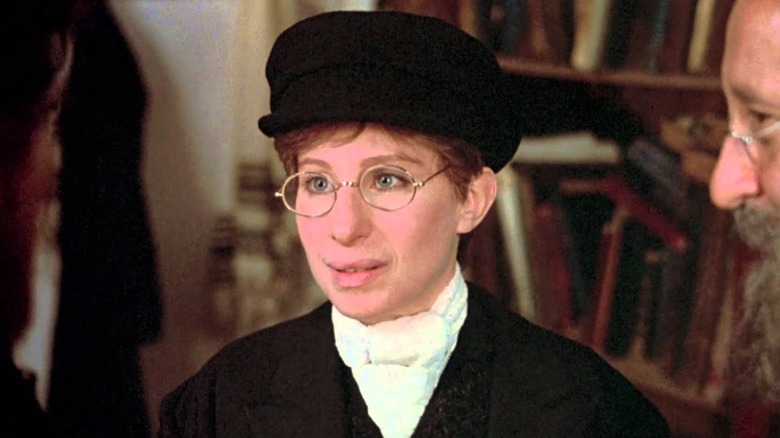 Yentl wearing a hat and glasses in "Yentl"