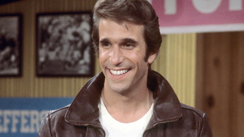 Arthur "Fonzie" Fonzarelli smiling in his signature leather jacket in "Happy Days" Season 1