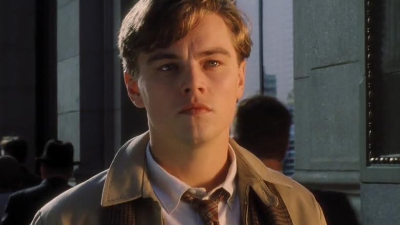 Frank Abagnale Jr. standing outside in "Catch Me If You Can"