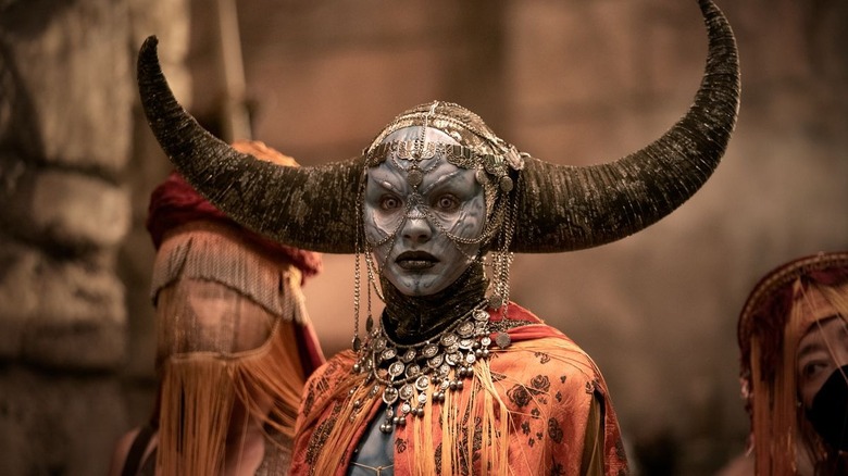 An alien stares ahead