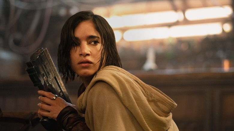 Kora looks around anxiously