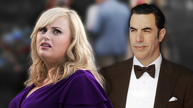 Rebel Wilson and Sacha Baron Cohen look on