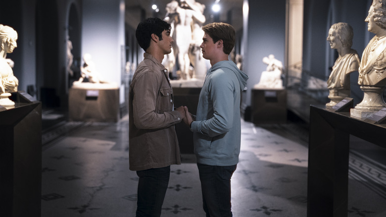 Henry and Alex holding hands in museum