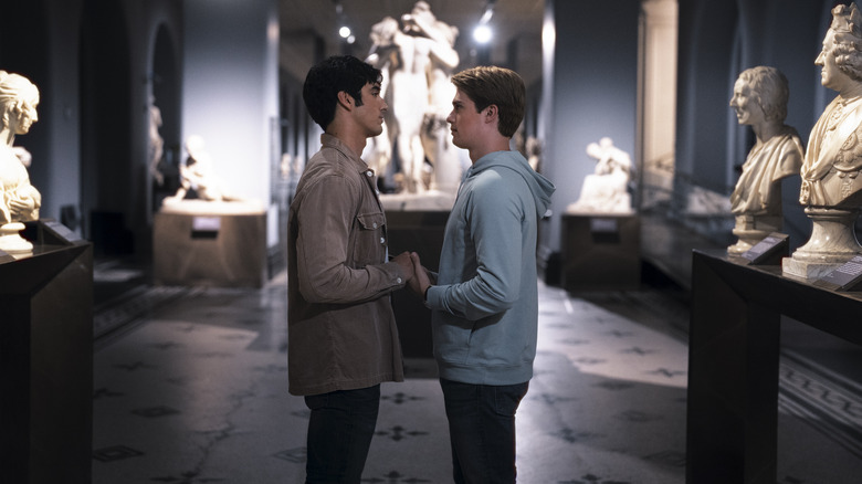 Alex and Henry holding hands at museum