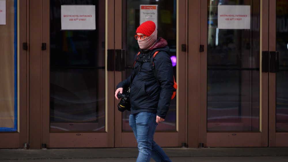 Photographer outside shuttered Regal Cinemas theater