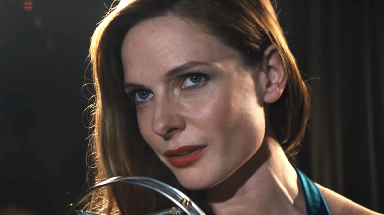 Rebecca Ferguson as Mae singing