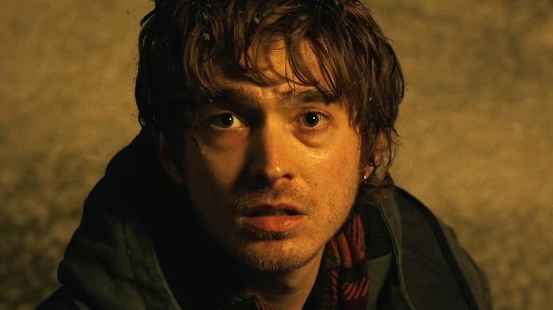 Bryan looking up nervously in Resident Evil (2026)