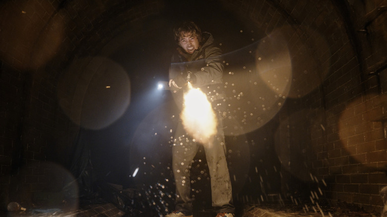 Bryan shooting a gun in Resident Evil (2026)