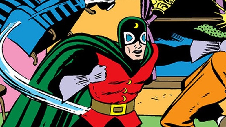 Doctor Mid-Nite punching a man