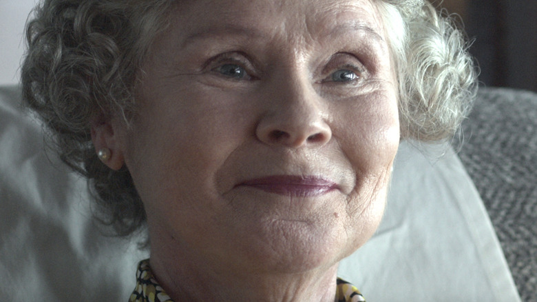 Imelda Staunton smiling as Queen Elizabeth II