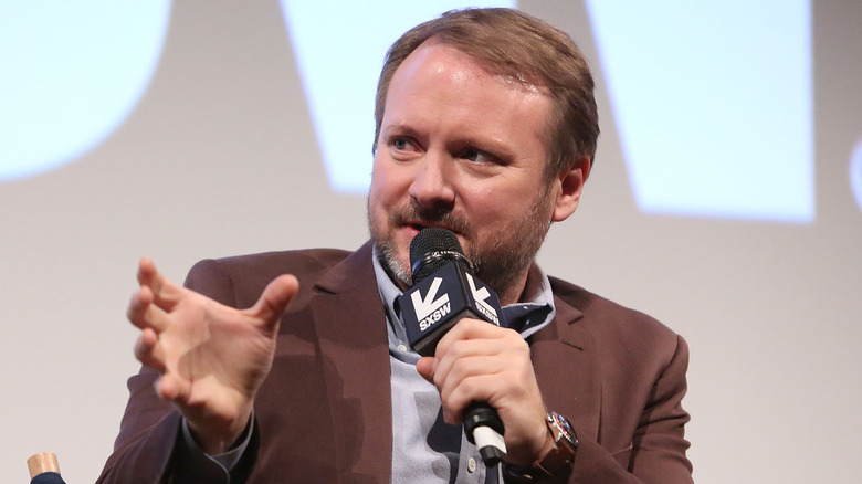 Rian Johnson talking in microphone