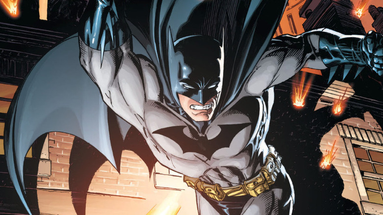 Batman swoops through alley