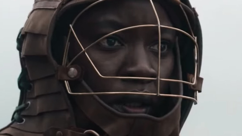Michonne wearing a makeshift helmet