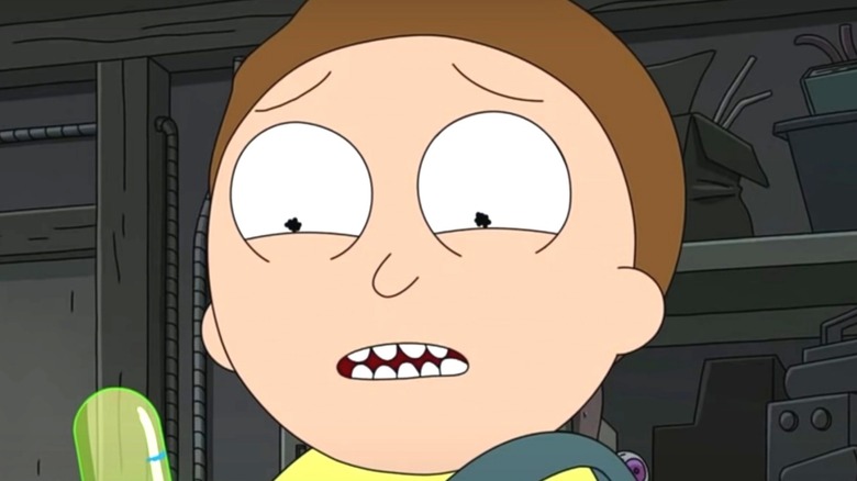 Morty holding a pickle in Ricky and Morty