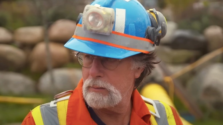 Rick Lagina in a blue helmet.