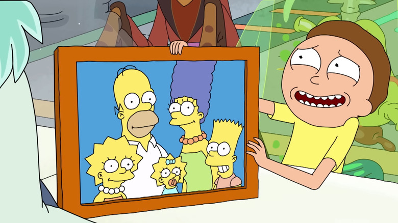 Morty holds a photo of The Simpsons