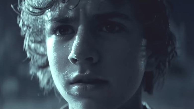 Percy Jackson standing in the rain