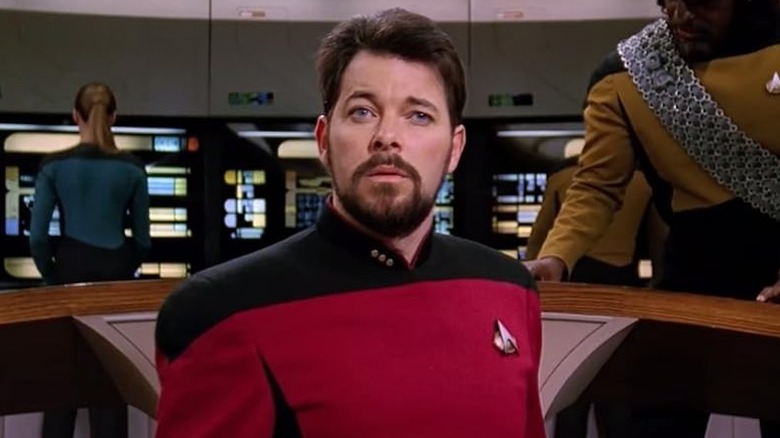 Riker standing on the bridge with Worf over his left shoulder in Star Trek: The Next Generation (1987)